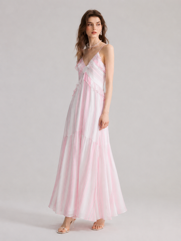 A French-style slip dress with pink and white stripes and ruffle details